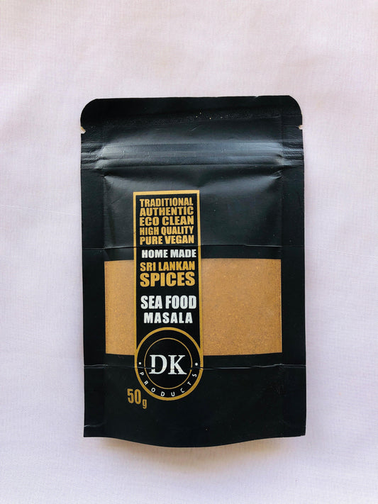 Black packaging of DK Sea Food Masala on a white background