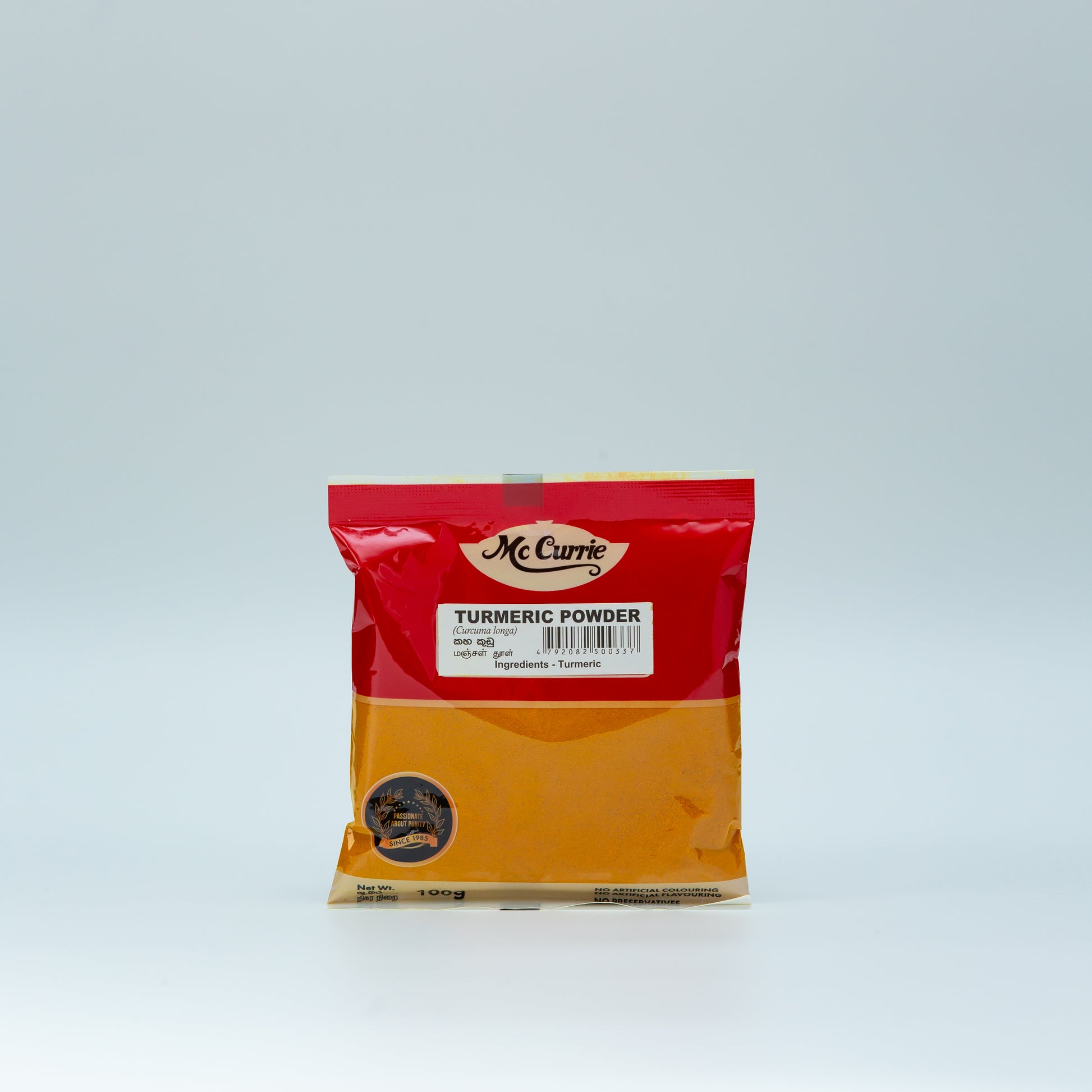 Bag of McCurry Turmeric Powder on a light gray background